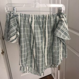 green and white off the should shirt